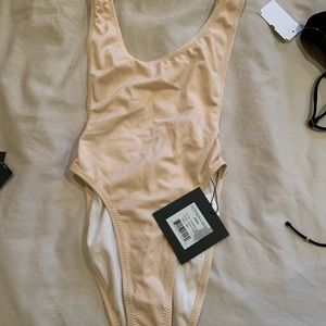 Norma kamali one piece highrise side view